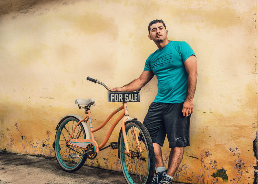 Man with bike preps for a DIY estate sale