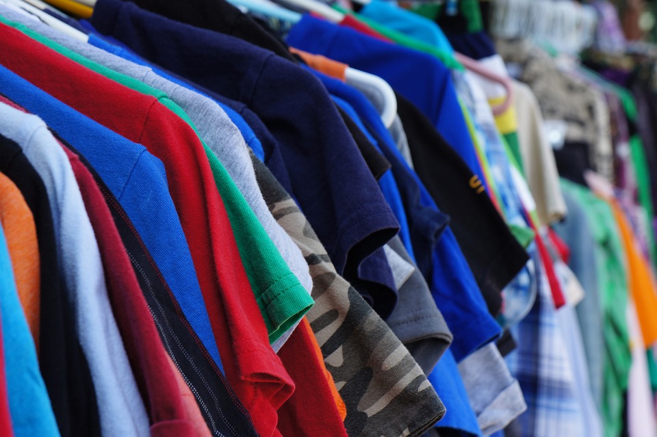clothes on a rack at yard sale