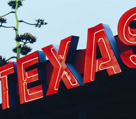 A giant, red neon sign that says “Texas”