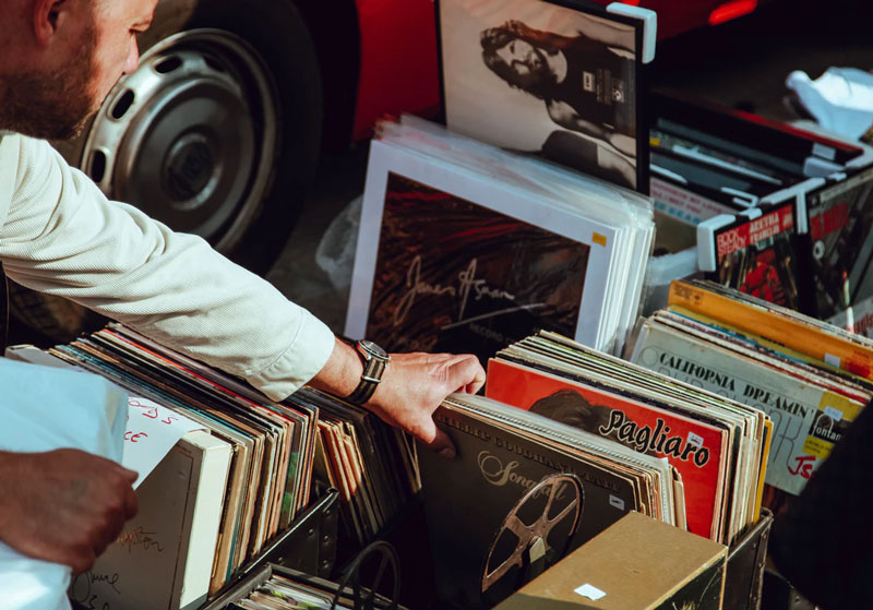 browsing records at summer garage sales