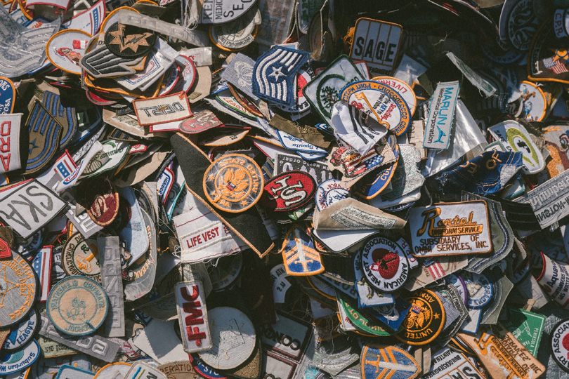 A variety of patches cluttered together.